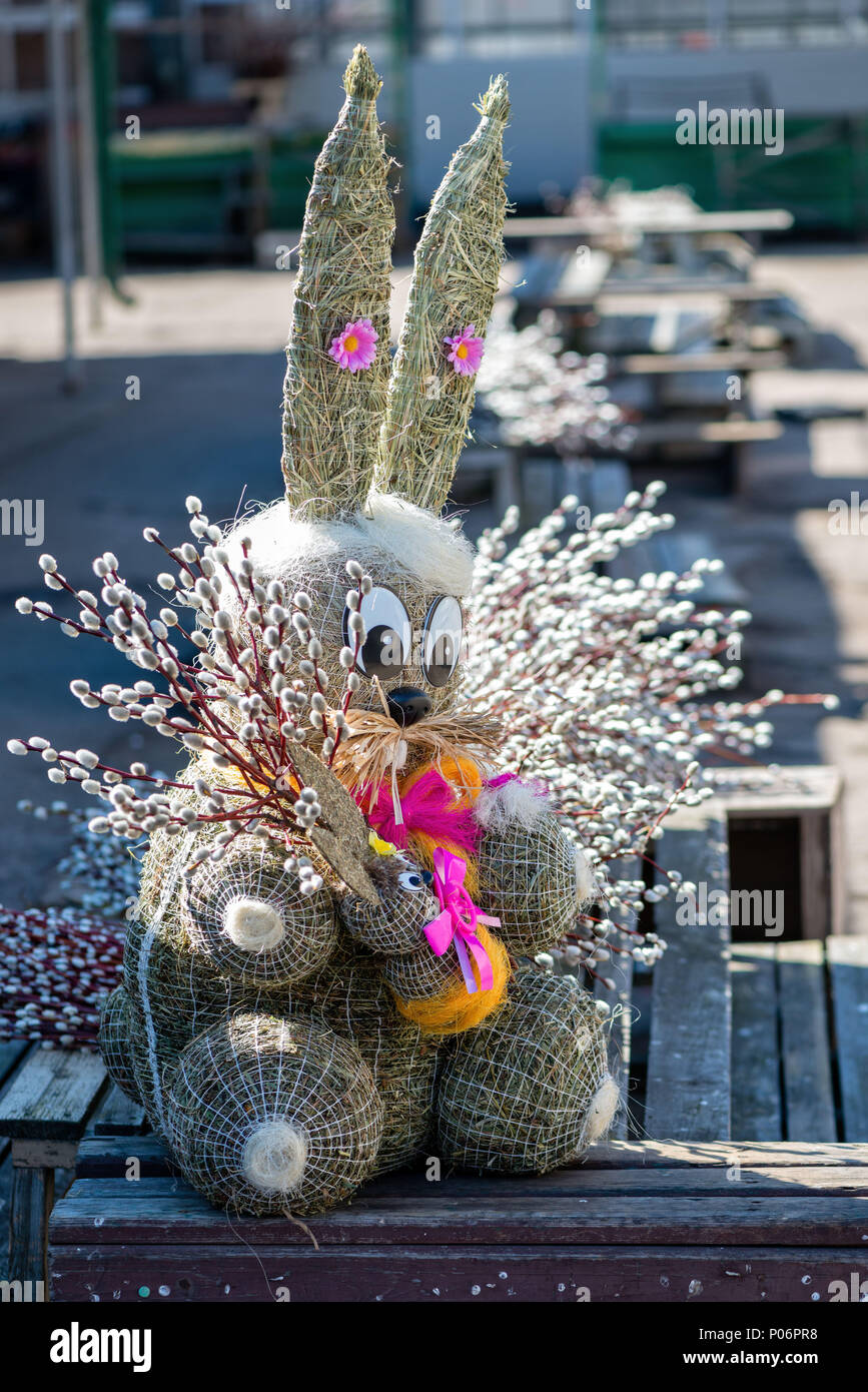 Straw-shaped bunny shapes with willow branches twings. Easter decorations. Easter holidays. Stock Photo