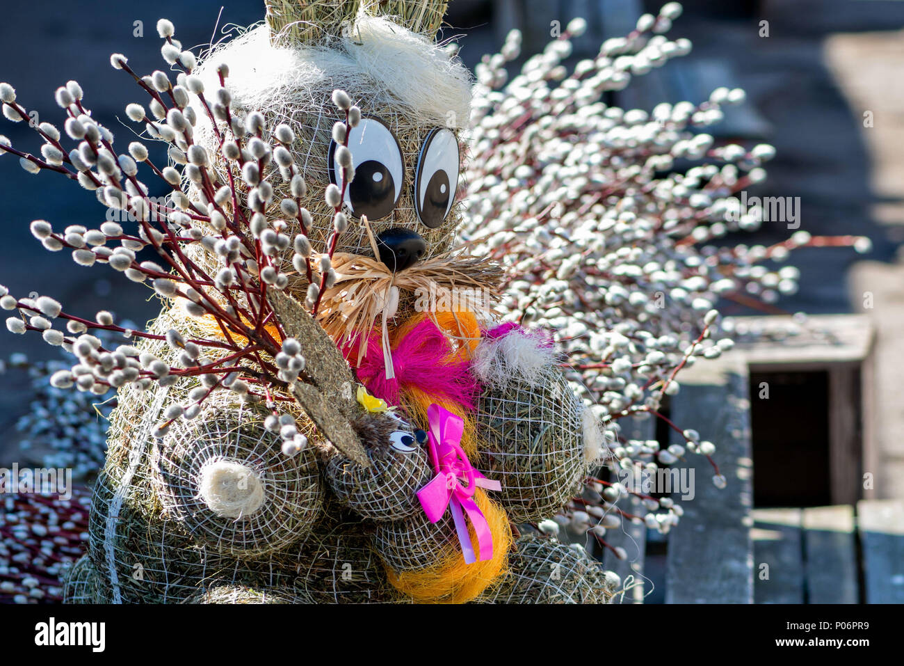 Straw-shaped bunny shapes with willow branches twings. Easter decorations. Easter holidays. Stock Photo