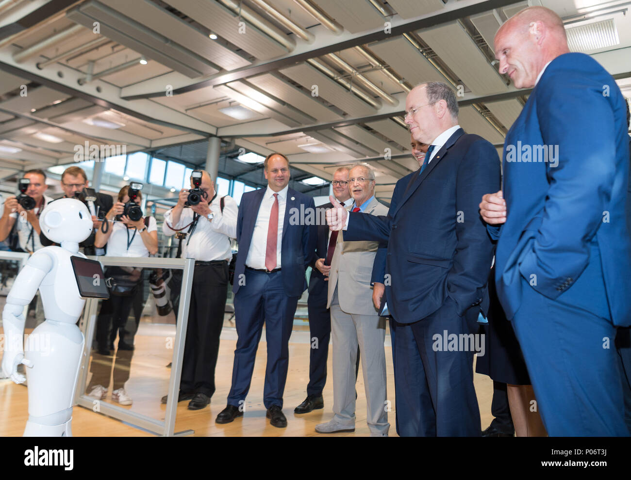 08 June 18 Germany Dresden Albert Ii Prince Of Monaco 2 F R And Thomas Ulbrich R Vw Board Of Management Member Responsible For E Mobility Looking At Pepper The Robot During His Visit To