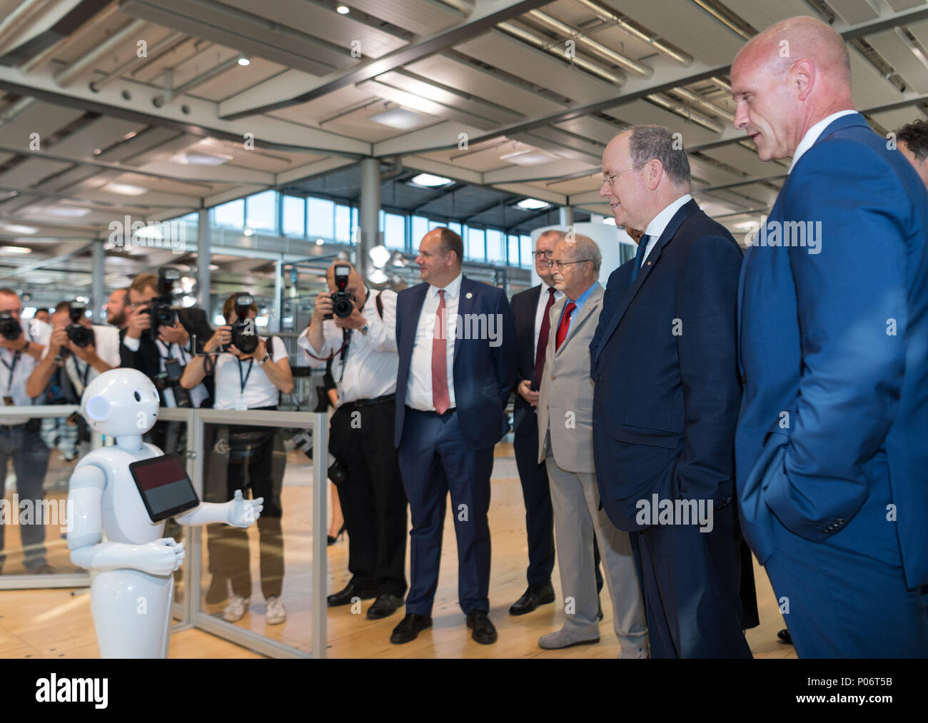 08 June 18 Germany Dresden Albert Ii Prince Of Monaco 2 F R And Thomas Ulbrich R Vw Board Of Management Member Responsible For E Mobility Looking At Pepper The Robot During His Visit To