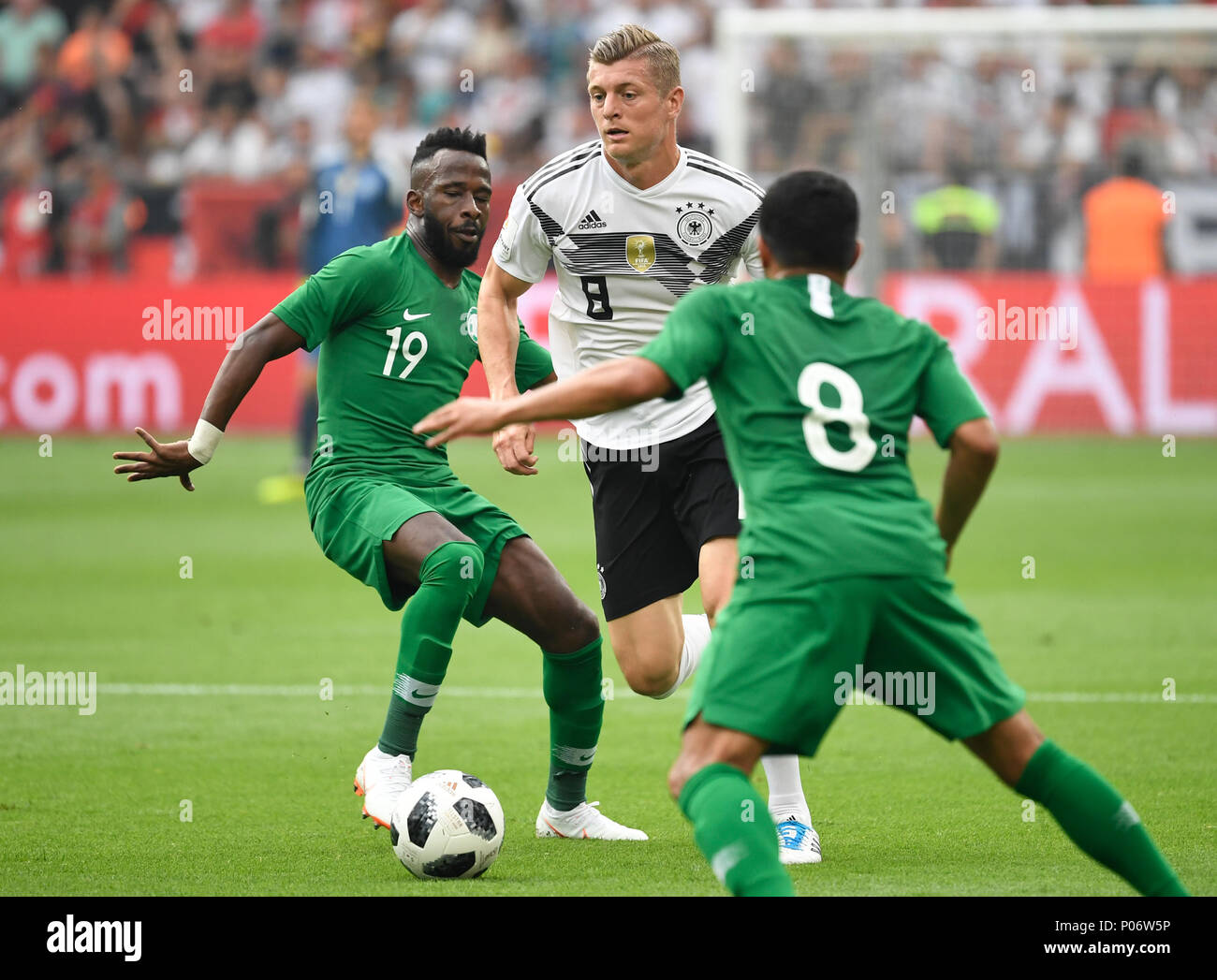 08 June 2018, Germany, Leverkusen: Football international friendly, Germany vs Saudi Arabia at the BayArena. Germany' Toni Kroos (c) and Saudi's Fahad Al-Muwallad and Saudi's Yahia Al-Shehri in action. Photo: Ina Fassbender/dpa Stock Photo