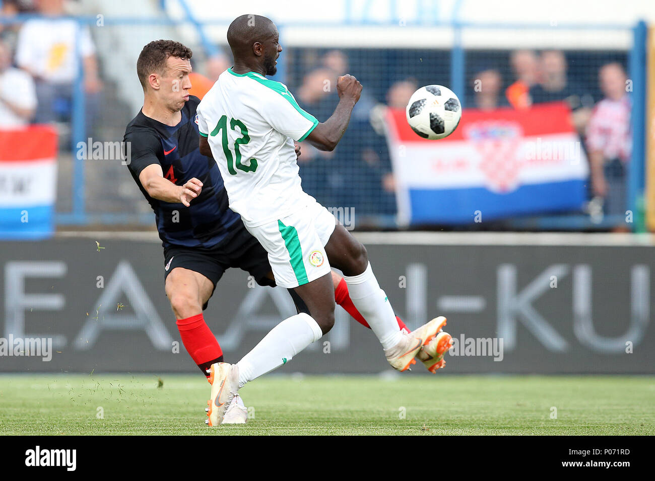 Osijek, Croatia. 8th June, 2018. Ivan Perisic (L) of Croatia vies with Youssouf Sabaly of Senegal during the international friendly match ahead of the FIFA World Cup in Osijek, Croatia, on June 8, 2018. Croatia won 2-1. Credit: Goran Stanzl/Xinhua/Alamy Live News Stock Photo