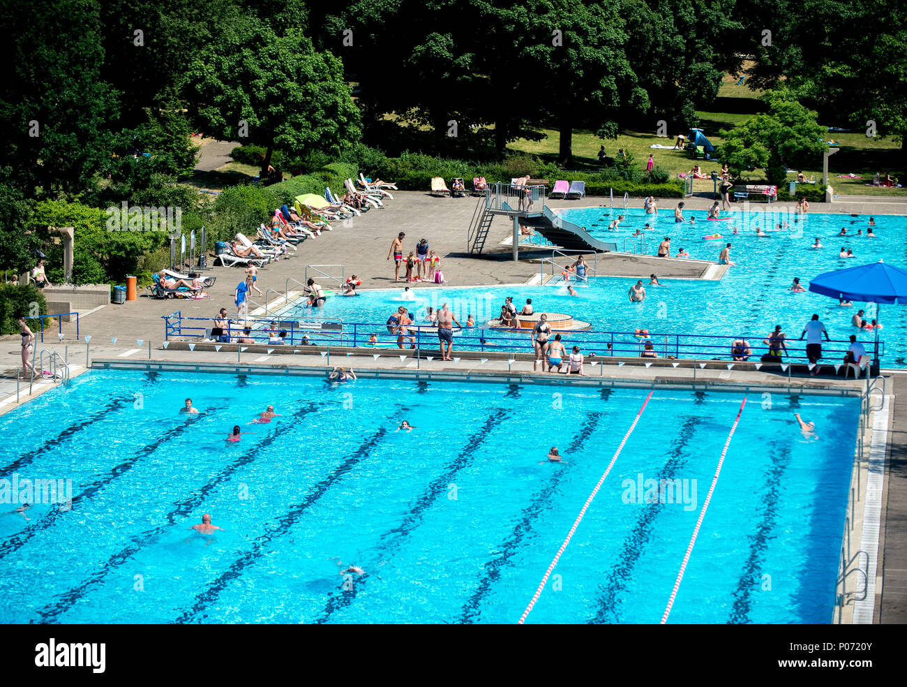 07 June 2018, Germany, Hanover People swimming in various pools at the