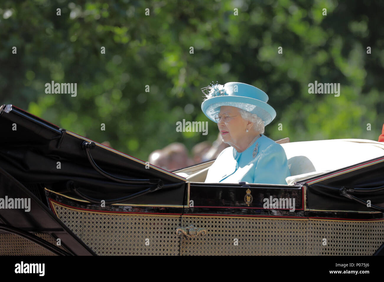 London, UK, 9 June 2018.  HM The Queen, rides along The Mall, alone, in her horse drawn carriage, Trooping the Colour Credit: amanda rose/Alamy Live News Stock Photo
