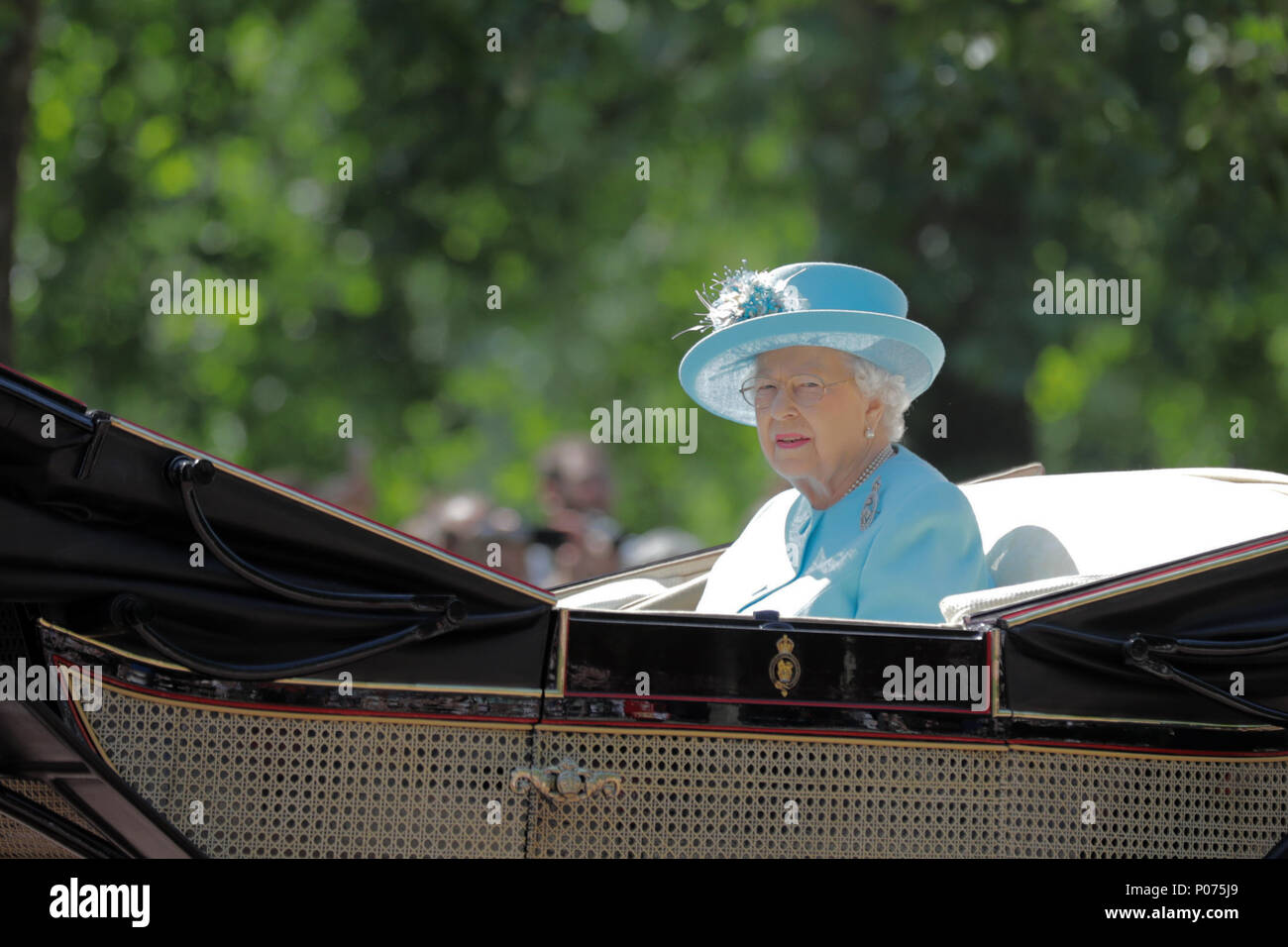 London, UK, 9 June 2018.  HM The Queen, rides along The Mall, alone, in her horse drawn carriage, Trooping the Colour Credit: amanda rose/Alamy Live News Stock Photo