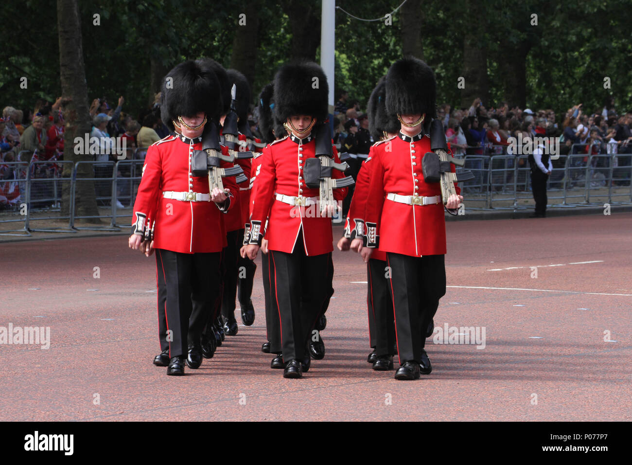 London, UK 9 June 2018: Hundreds of Guardsmen march along the Mall to the Horse Guards Parade Ground as they make their way to the Horse Guards Parade Ground on 9 June 2018. Over 1400 parading soldiers, 200 horses and 400 musicians come together each June in a great display of military precision, horsemanship and fanfare to mark The Queen's official birthday. Credit: David Mbiyu Stock Photo