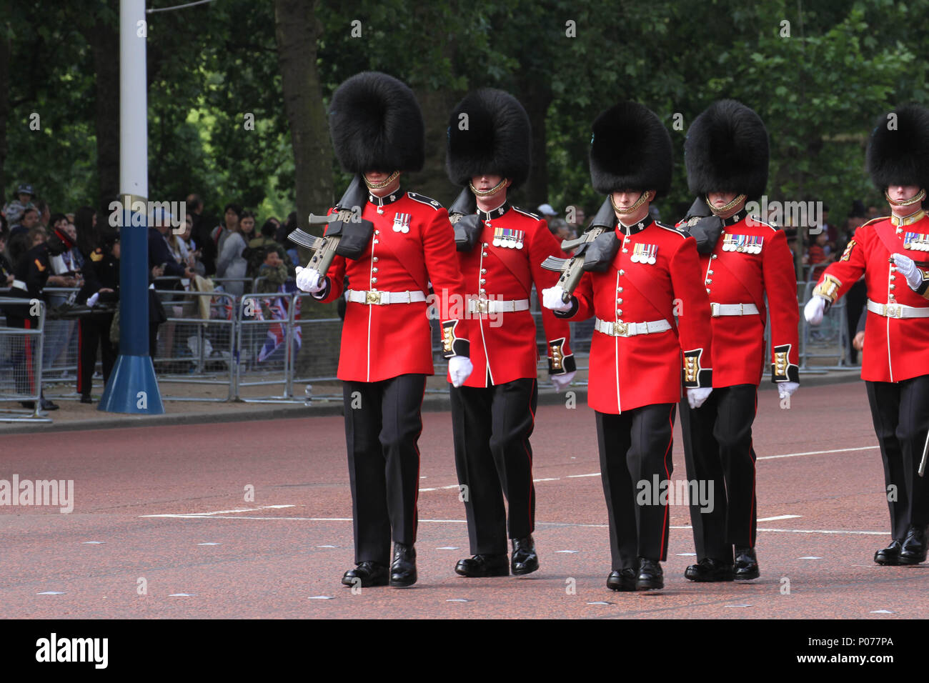 London, UK 9 June 2018: Hundreds of Guardsmen march along the Mall to the Horse Guards Parade Ground as they make their way to the Horse Guards Parade Ground on 9 June 2018. Over 1400 parading soldiers, 200 horses and 400 musicians come together each June in a great display of military precision, horsemanship and fanfare to mark The Queen's official birthday. Credit: David Mbiyu Stock Photo