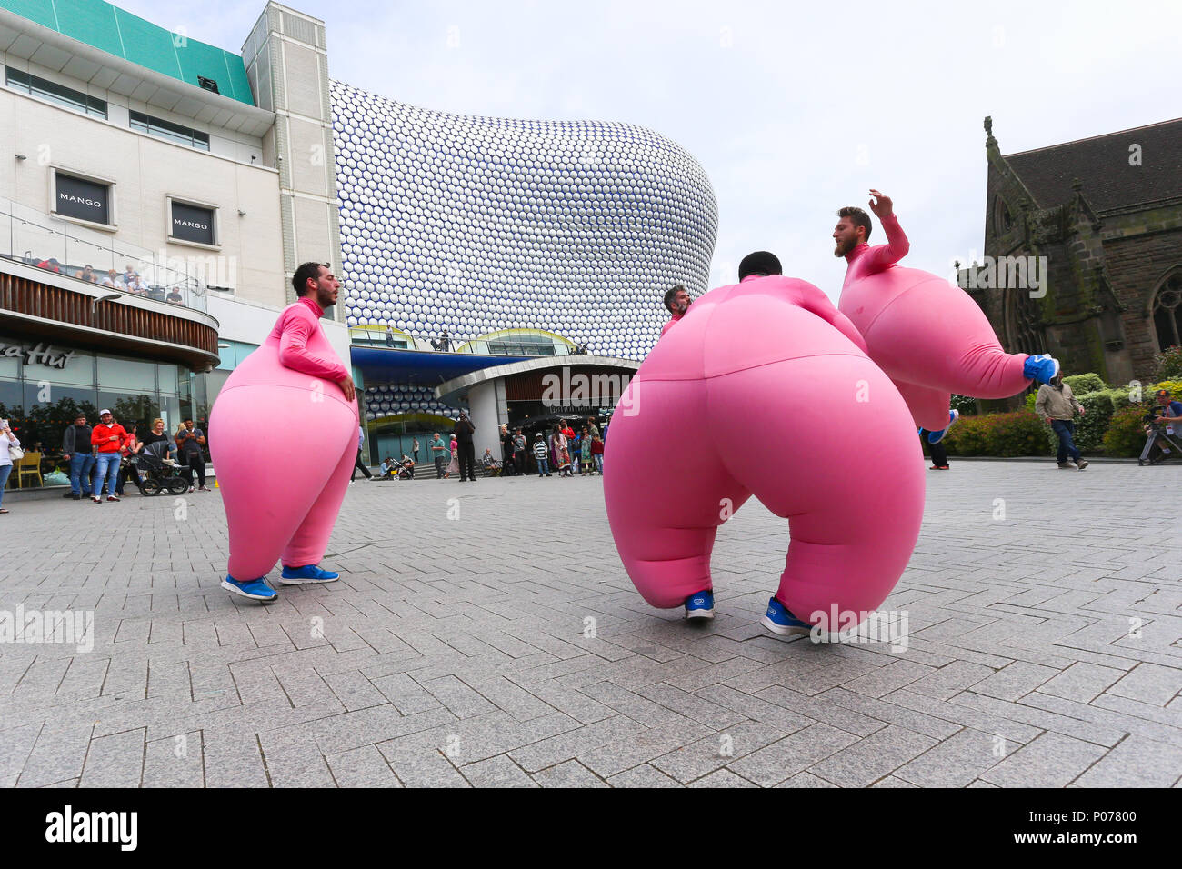 As part of Birmingham International Dance Festival, the French dance group Compagnie Didier Theron perform La Grande Phase through the city centre of Birmingham among the crowds of shoppers. The dancers wear inflated latex costumes to enhance the feeling of weightlessness and to magnify their balletic movements. Peter Lopeman/Alamy Live News Stock Photo