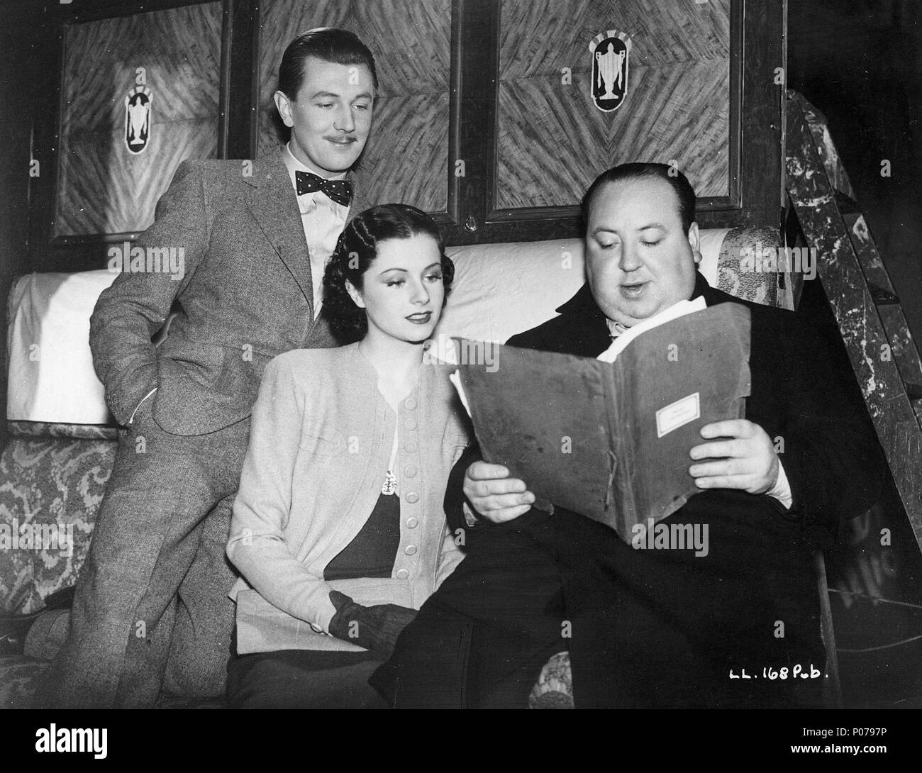Original Film Title: THE LADY VANISHES.  English Title: THE LADY VANISHES.  Film Director: ALFRED HITCHCOCK.  Year: 1938.  Stars: MICHAEL REDGRAVE; ALFRED HITCHCOCK; MARGARET LOCKWOOD. Credit: GAINSBOROUGH FILMS / Album Stock Photo