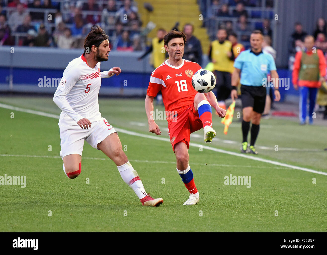 Moscow, Russia - June 5, 2018. Russian midfielder Yuri Zhirkov against Turkish midfielder Okay Yokuslu during international friendly against Russia at Stock Photo