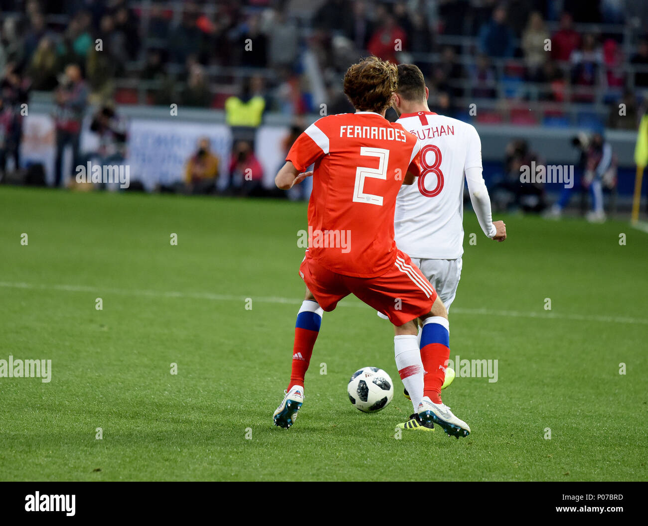 Moscow, Russia - June 5, 2018. Turkish midfielder Oguzhan Ozyakup and Russian defender Mario Fernandes during international friendly against Russia at Stock Photo