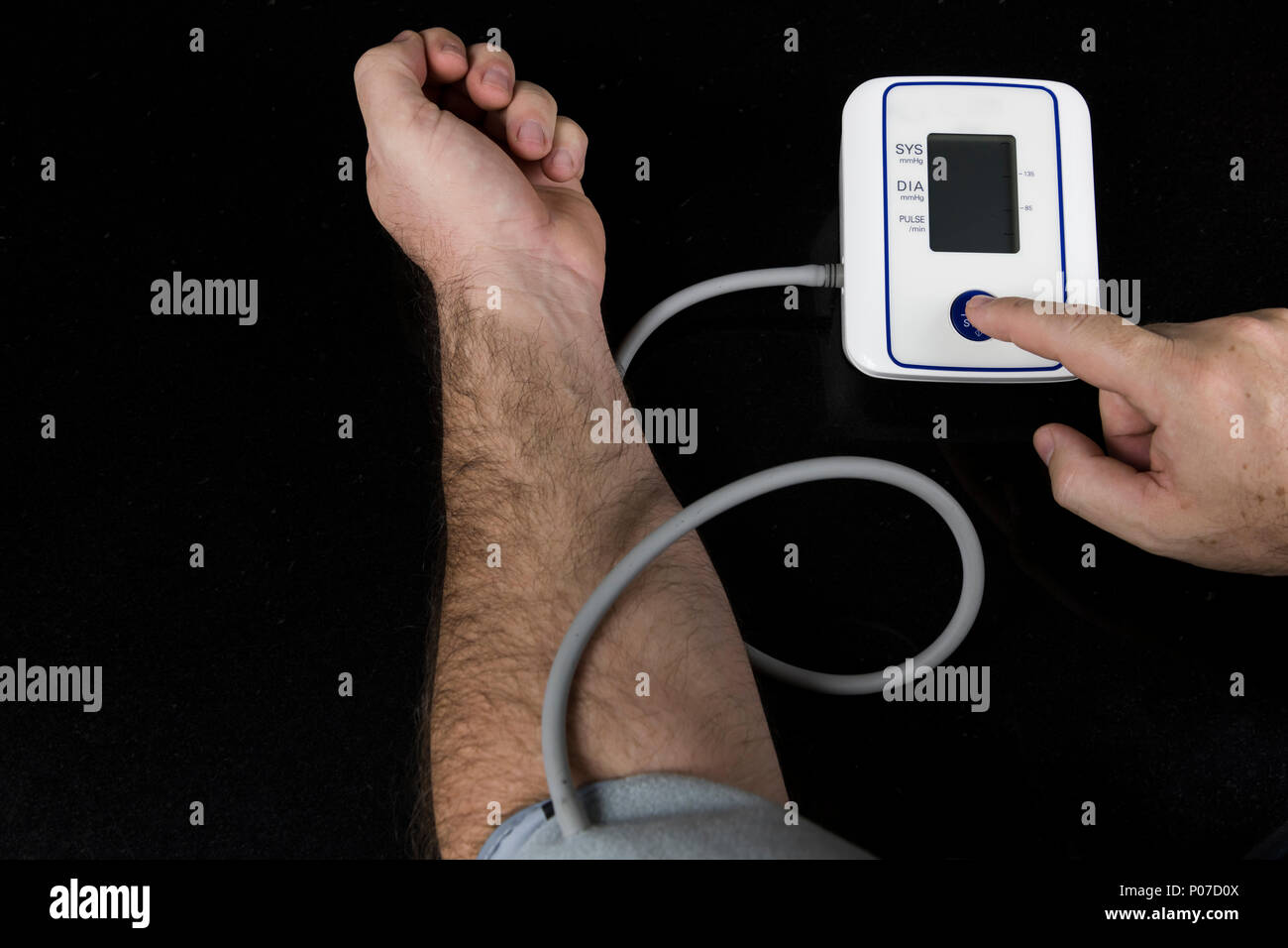 Patients Insert Arm Into The Automatic Blood Pressure Monitor. Stock Photo,  Picture and Royalty Free Image. Image 128859614.