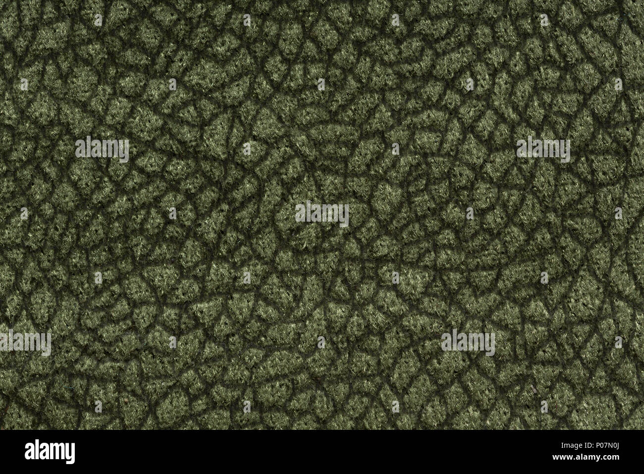 Strict textile background in dark green tone. Stock Photo
