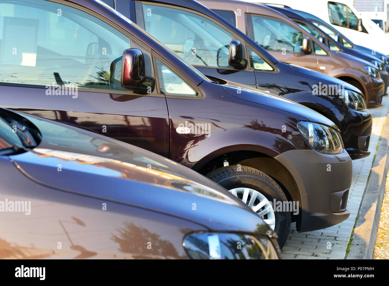 car dealership - many vehicles parked for sale in a row Stock Photo
