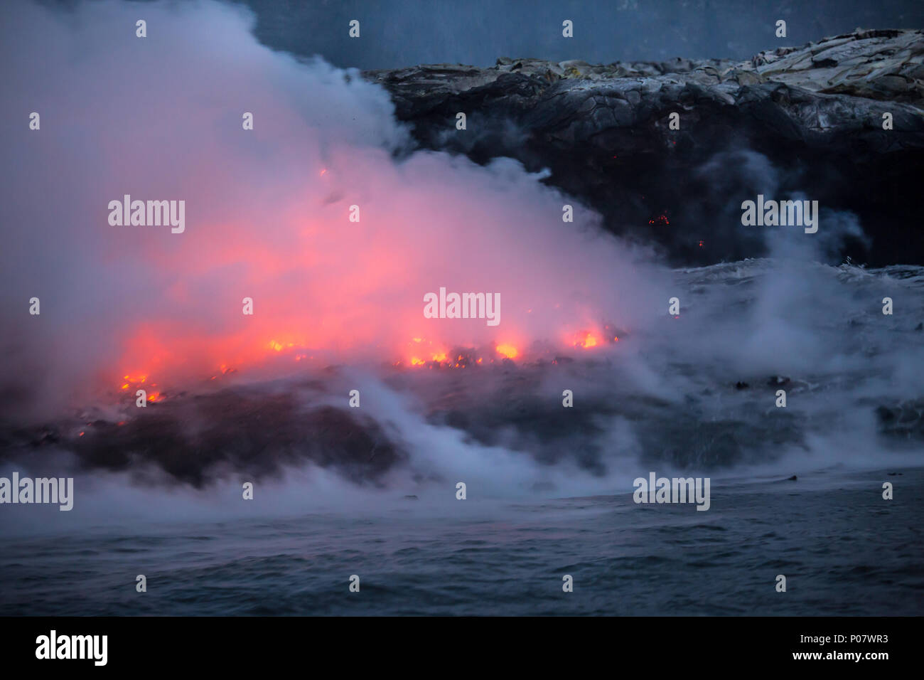 Hot molten lava flowing into the ocean on the Big Island of Hawaii