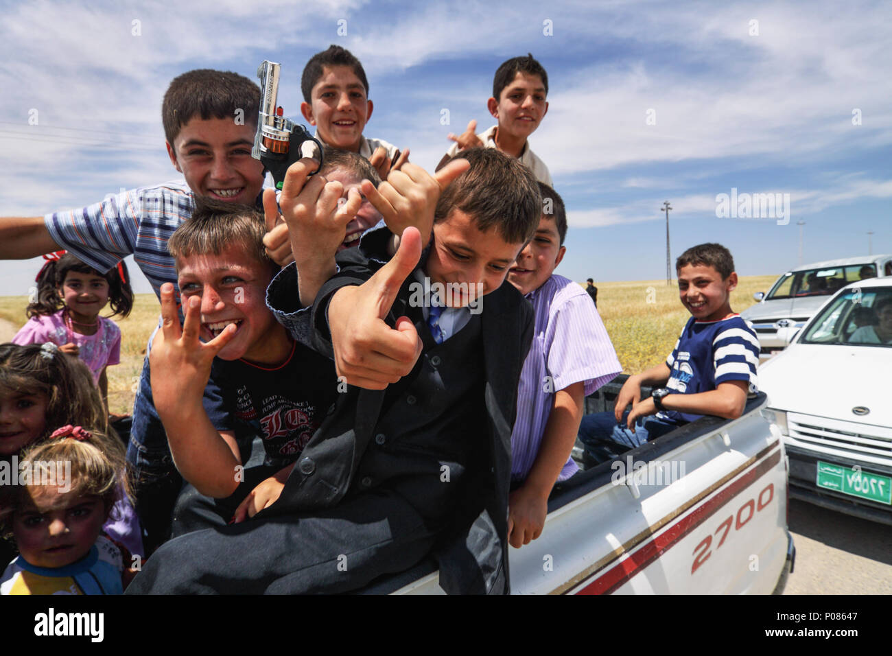 Kurdish Yezidi children coming from a religious festival at Khank, Kurdistan Region, Iraq Stock Photo