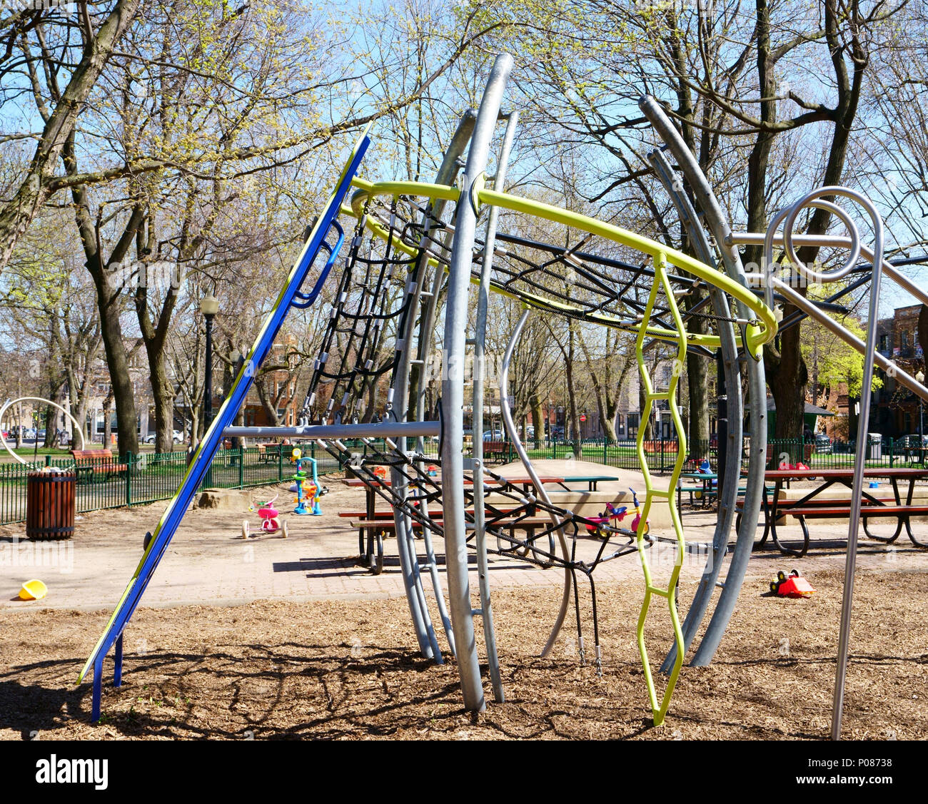 Playground in public park with a lot of colorful public toys abandonned by children. Stock Photo