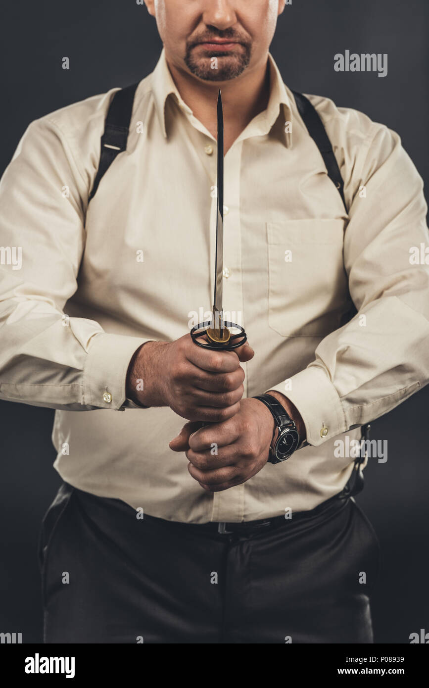 cropped shot of yakuza member holding japanese tanto knife in hands ...