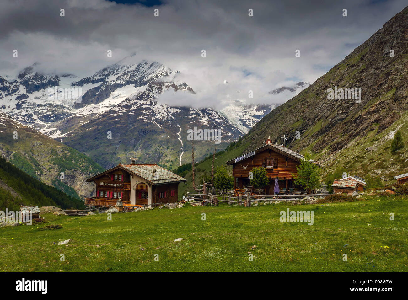 Traditional Swiss houses in the mountains at Taschalp, Switzerland Stock Photo