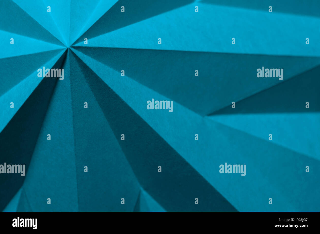 Blue Moon Pantone 17-4328. Blue monochrome abstract paper origami angular wallpaper background with negative space for titles. Stock Photo