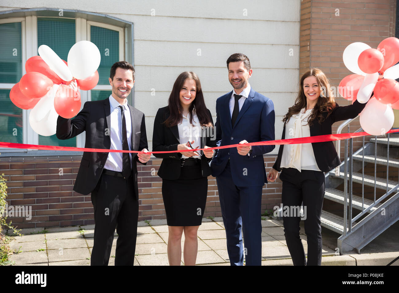 Ribbon cutting ceremony building hires stock photography and images
