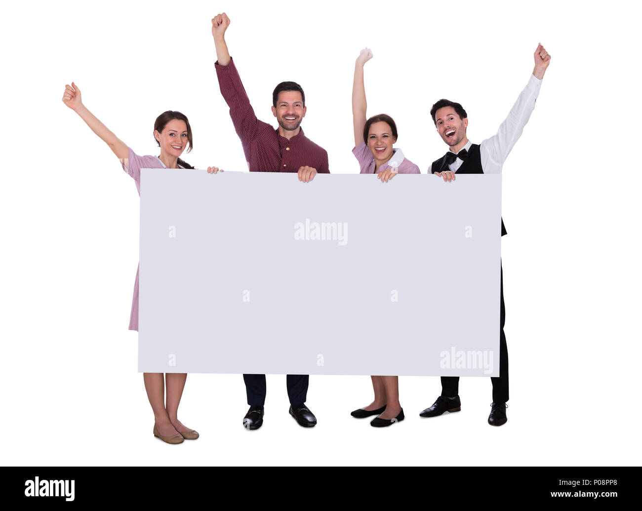 Excited Young Male And Female Staff Holding Billboard Raising Their Arms On White Background Stock Photo