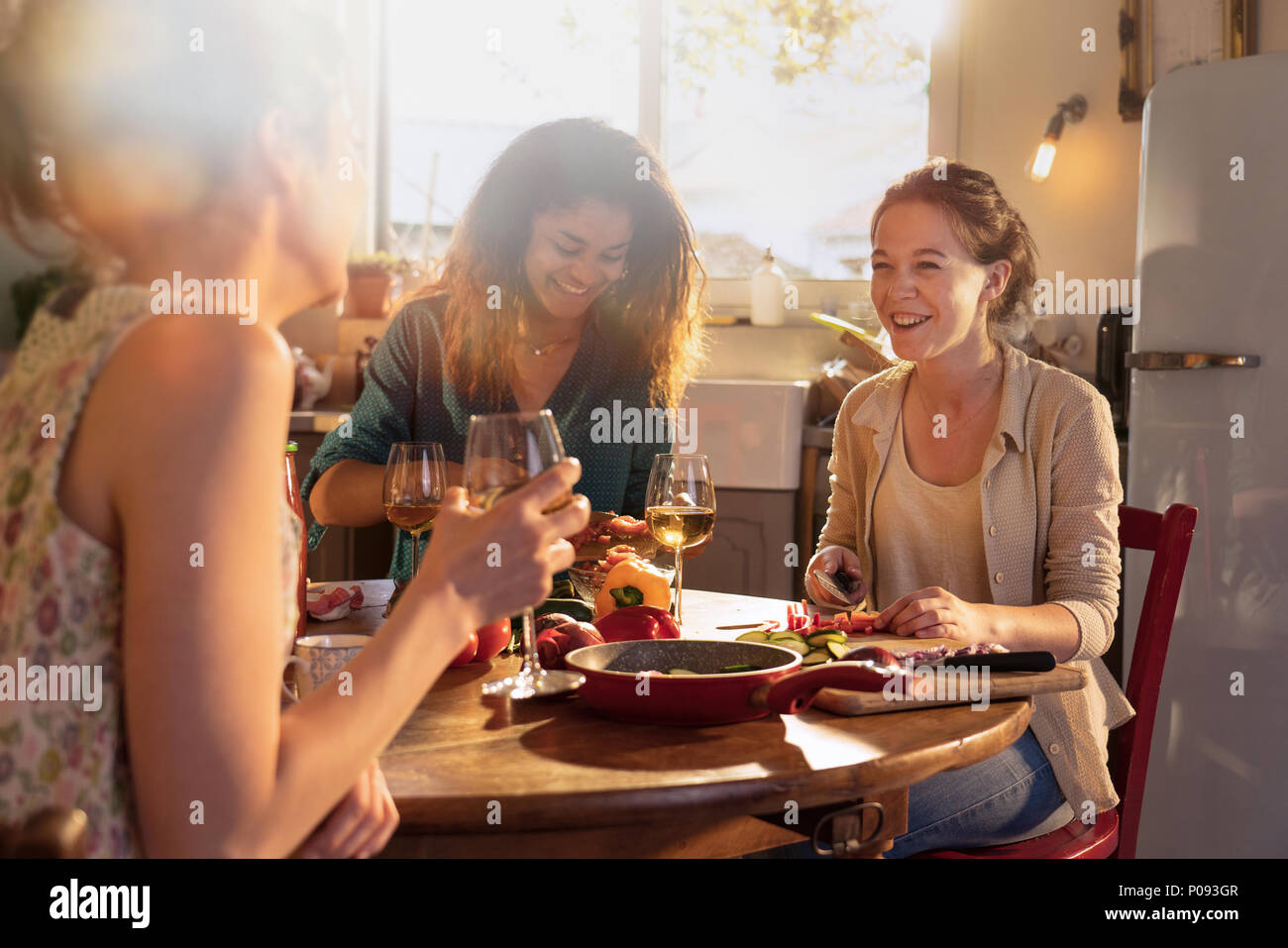 Multi-ethnic group of friends having fun while preparing lunch  Stock Photo