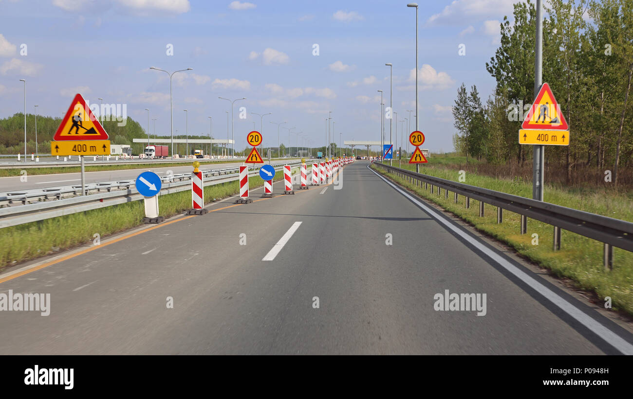 Road Works at Highway Narrowing Lanes Stock Photo