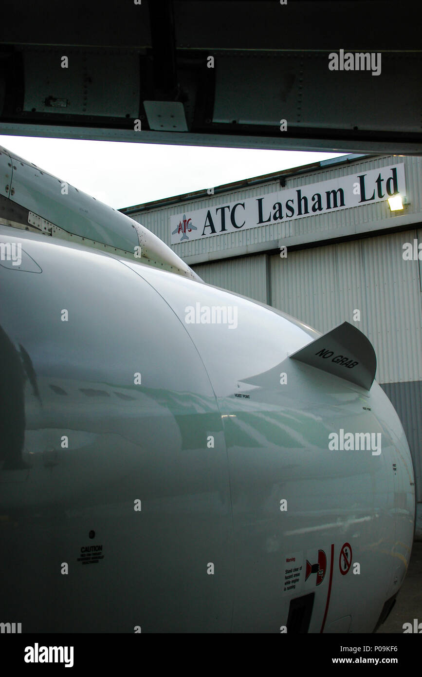 ATC Lasham Ltd aircraft engineering company at London Southend Airport. Framed by Airbus A320 jet plane engine and wing Stock Photo