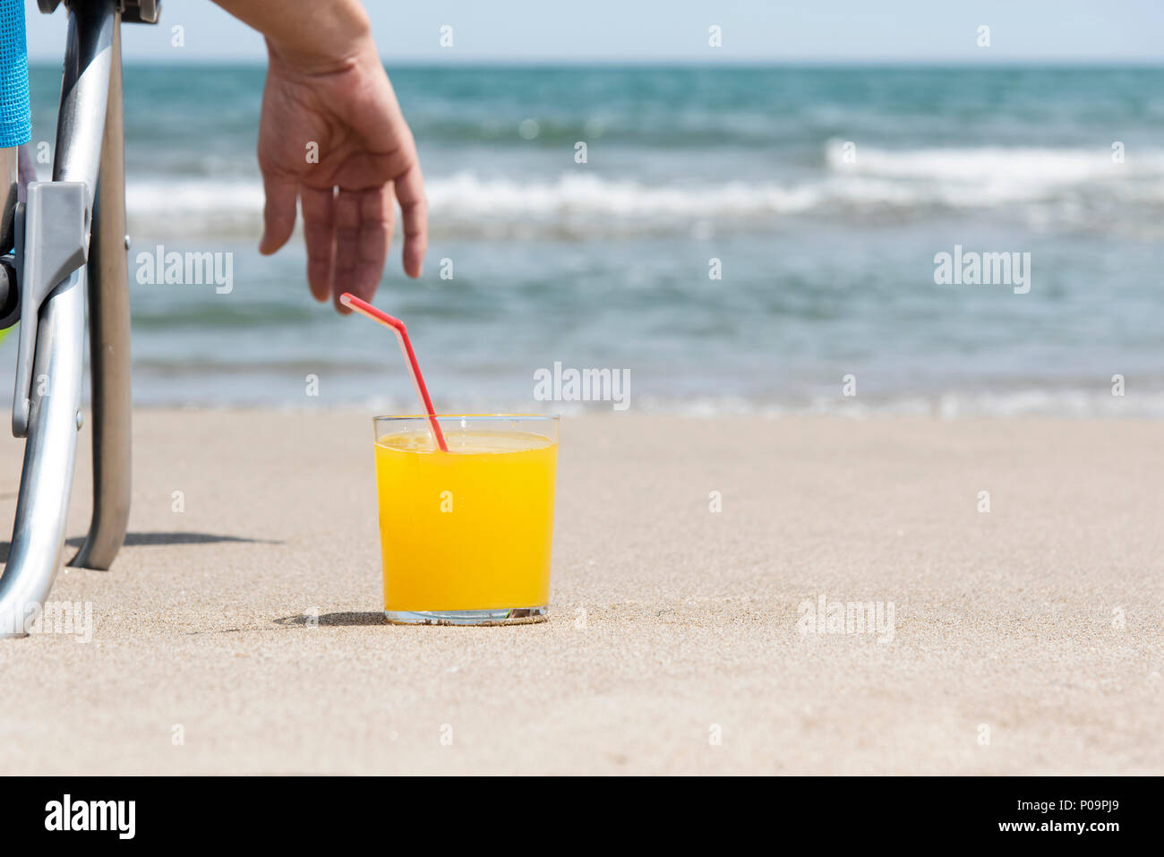 Man relaxing drink on beach hi-res stock photography and images - Alamy