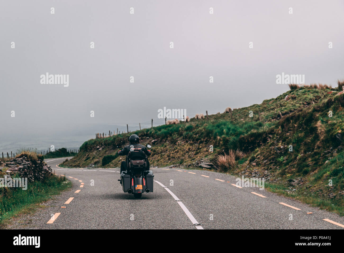 June 5th, 2018, Conor Pass, Ireland - people riding in motorcycles along the scenic road to Conor Pass in county Kerry, Ireland Stock Photo