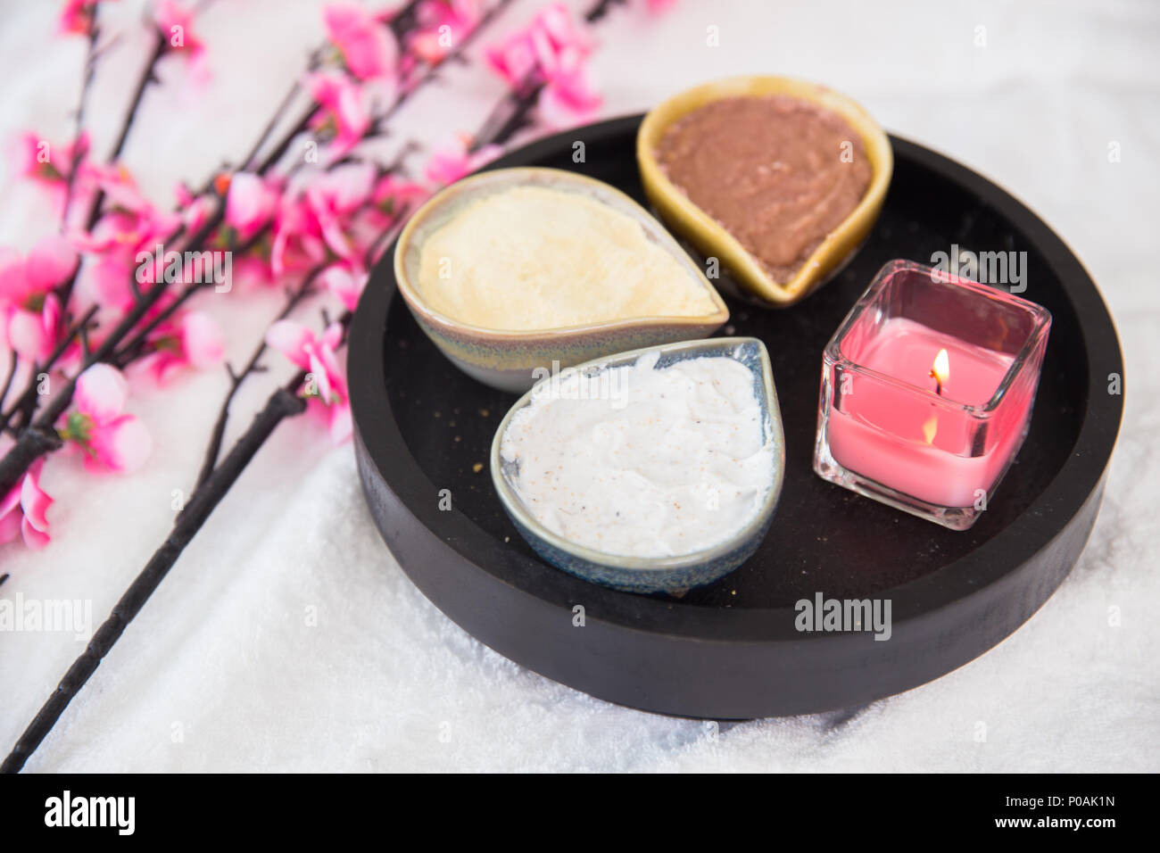 Herbal in spa in wooden tray for massage with flower and candle Stock Photo