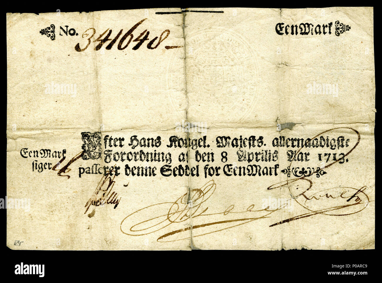 English: One Danish Mark printed 1713 (the first year of issue for paper  currency in Denmark). Under decree dated 8 April 1713 with three  authorizing signatures. (Blank reverse with two grey