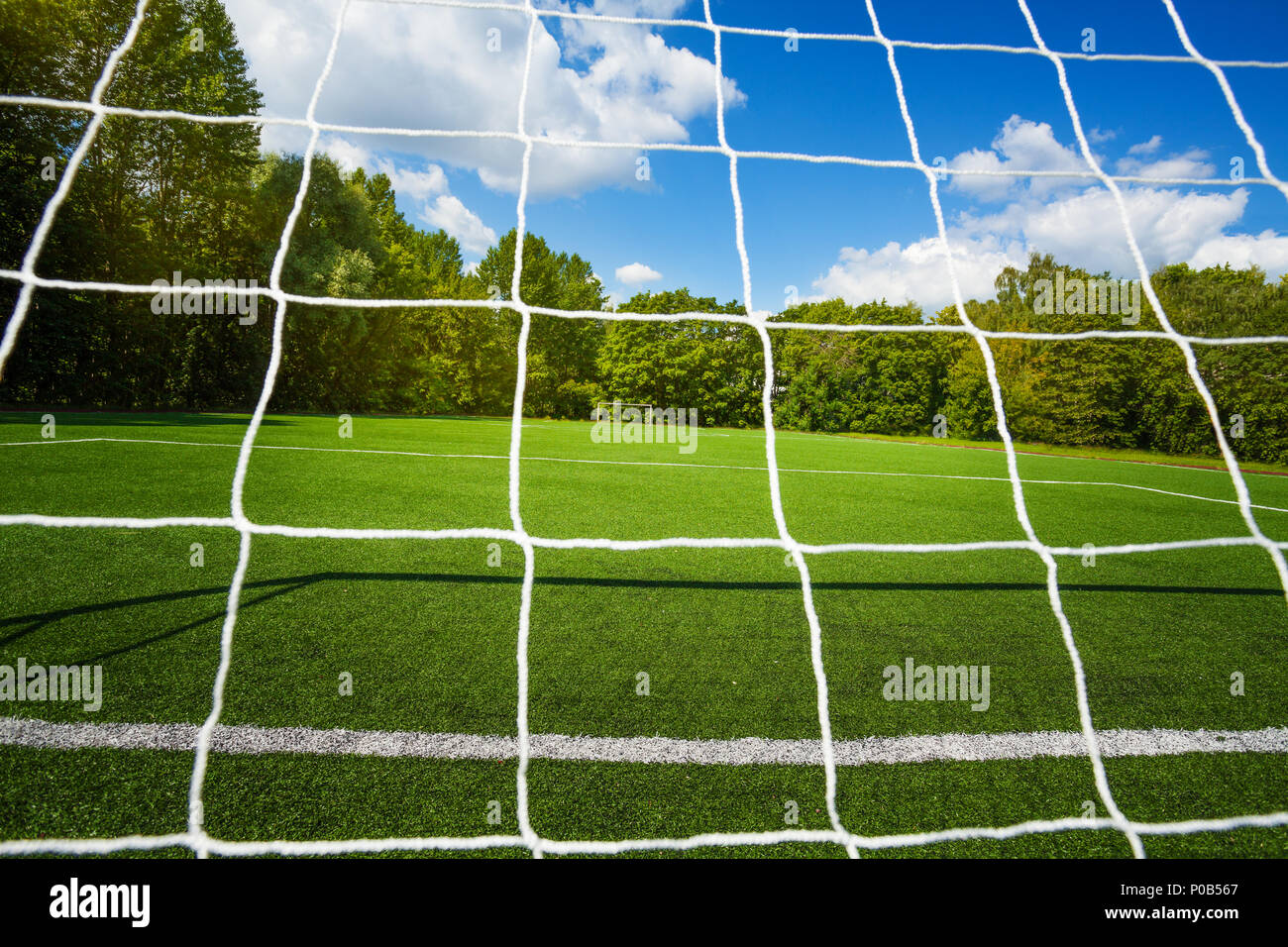 Football Net And Soccer Stadium On Background On Clean Empty Playing Field For Kids Stock Photo Alamy