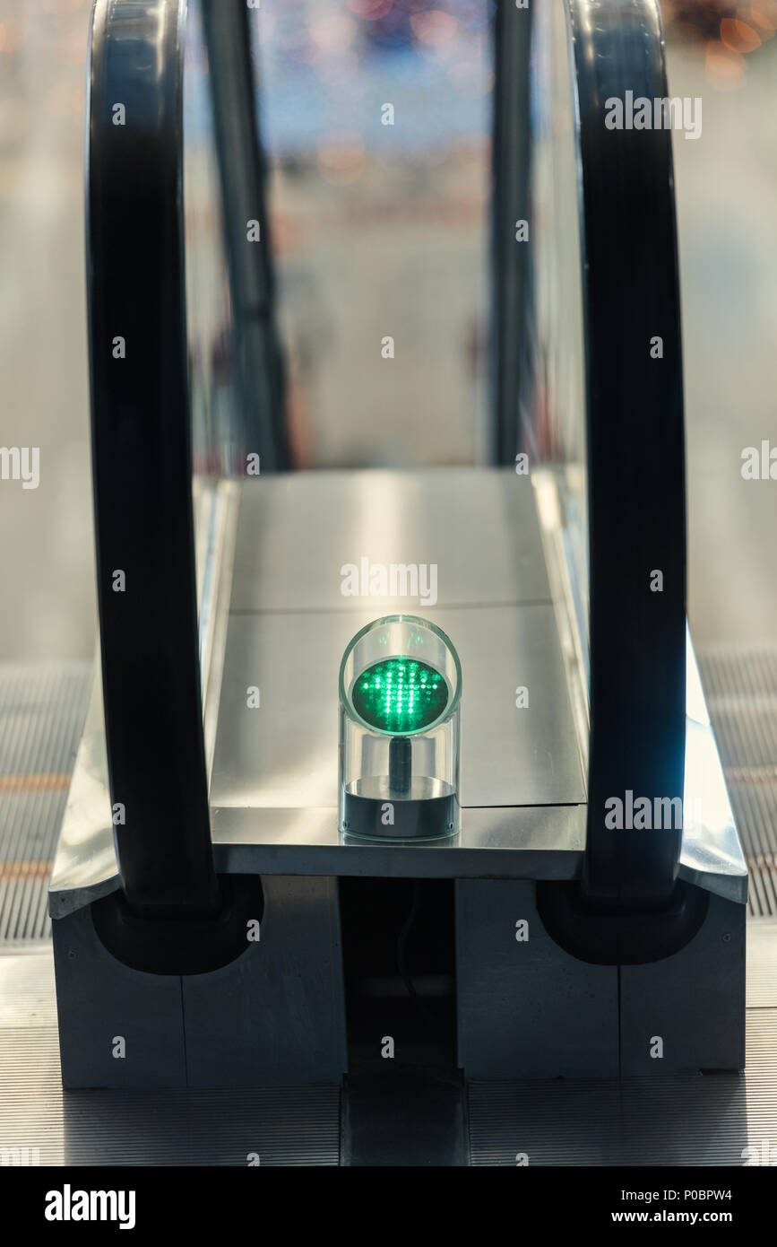 closeup shot of green light of escalator indoors Stock Photo Alamy