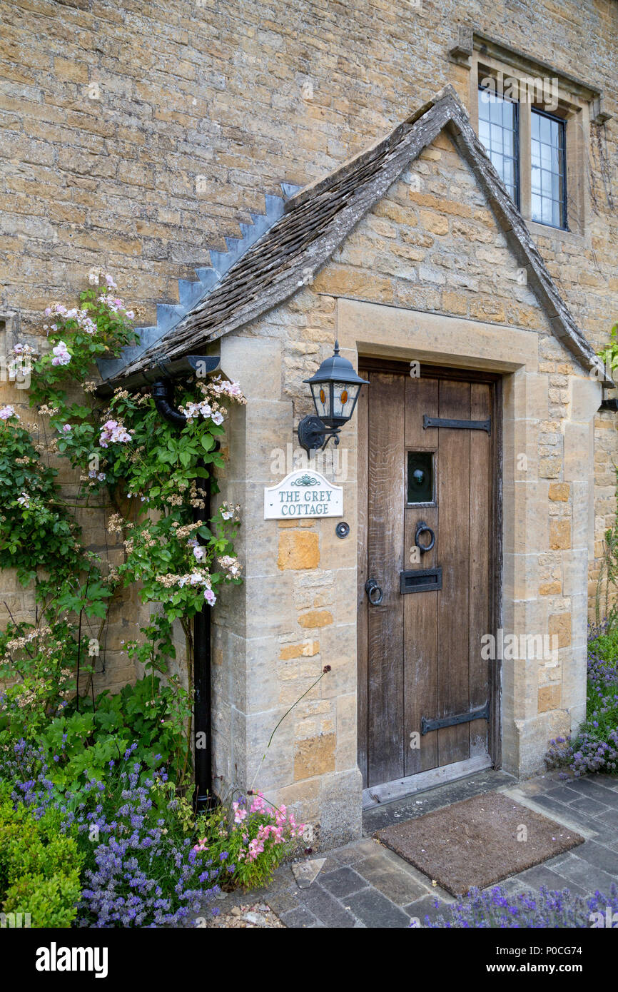 The Grey Cottage -  home in Lower Slaughter, the Cotswolds, Gloucestershire, England, UK Stock Photo
