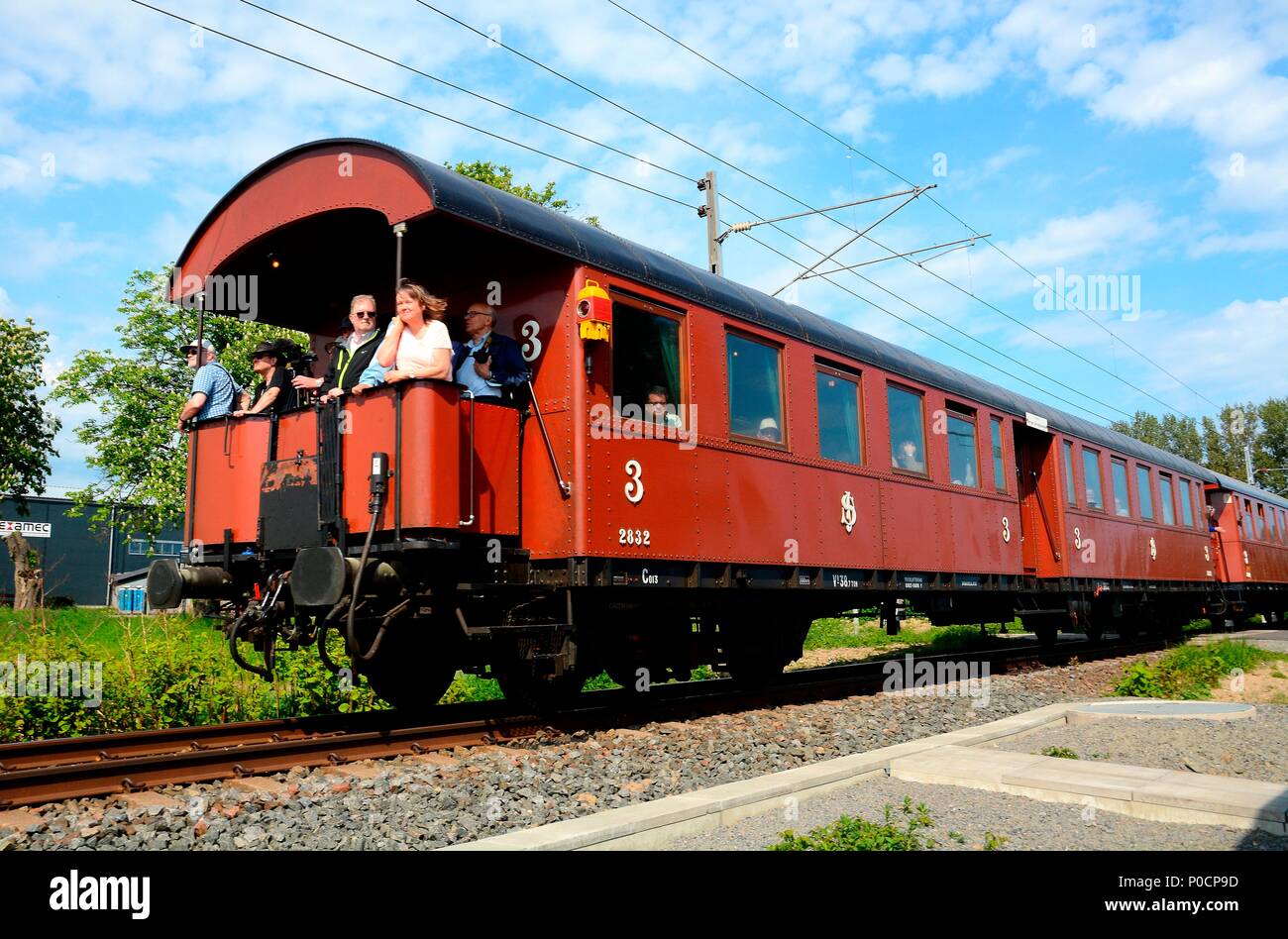 Old passenger railway wagon, built in 1931, with passenger on his way to Ystad, Scania, Sweden Stock Photo
