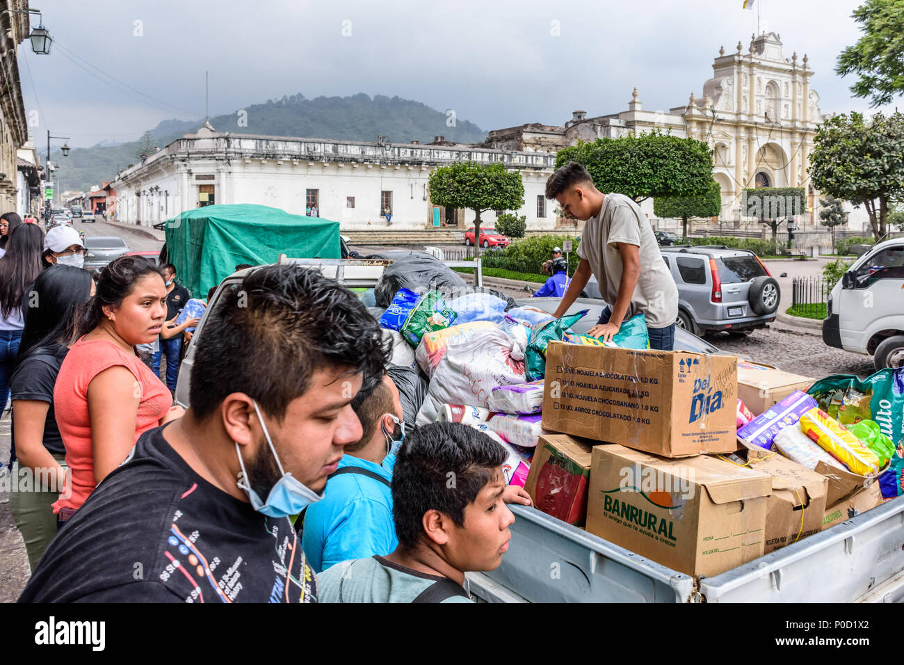 Antigua,, Guatemala -  June 5, 2018:  Volunteers load humanitarian aid supplies to take to area affected by eruption of Fuego (fire) volcano on June 3 Stock Photo