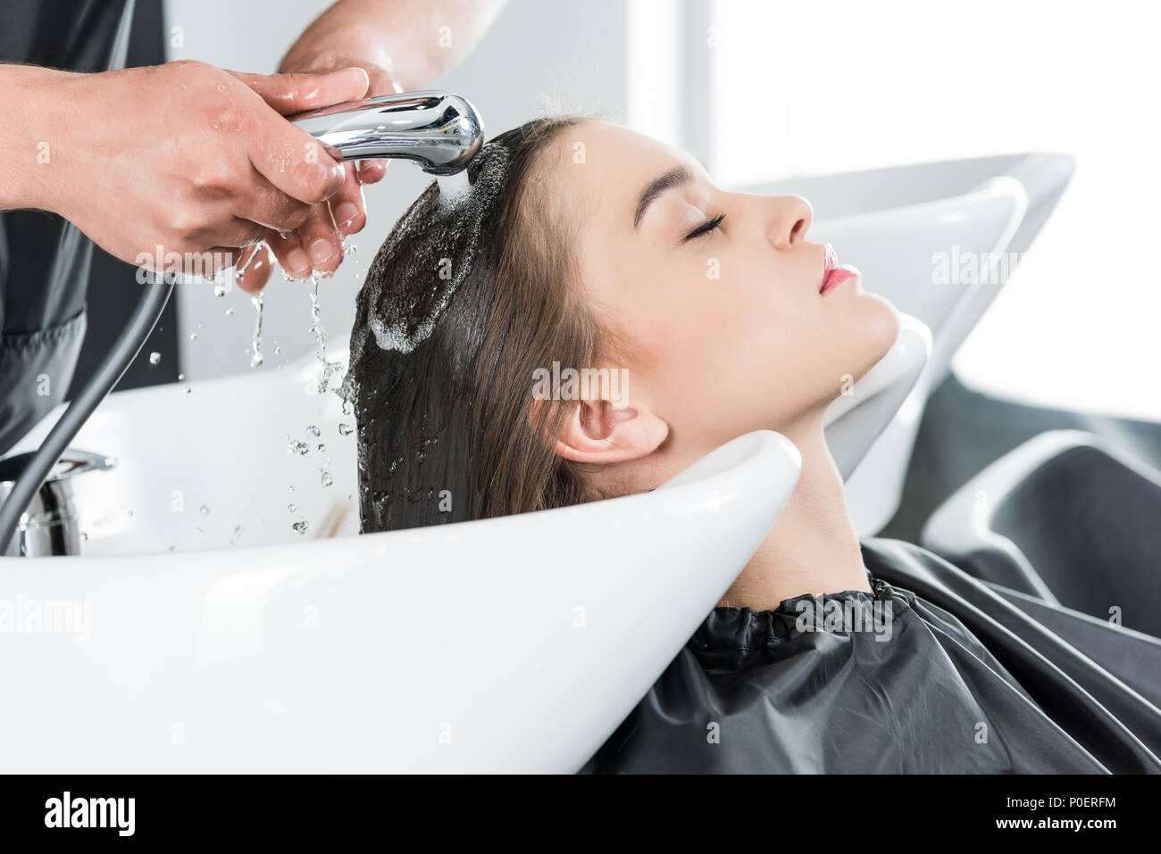 woman having hair wash in beauty salon Stock Photo Alamy