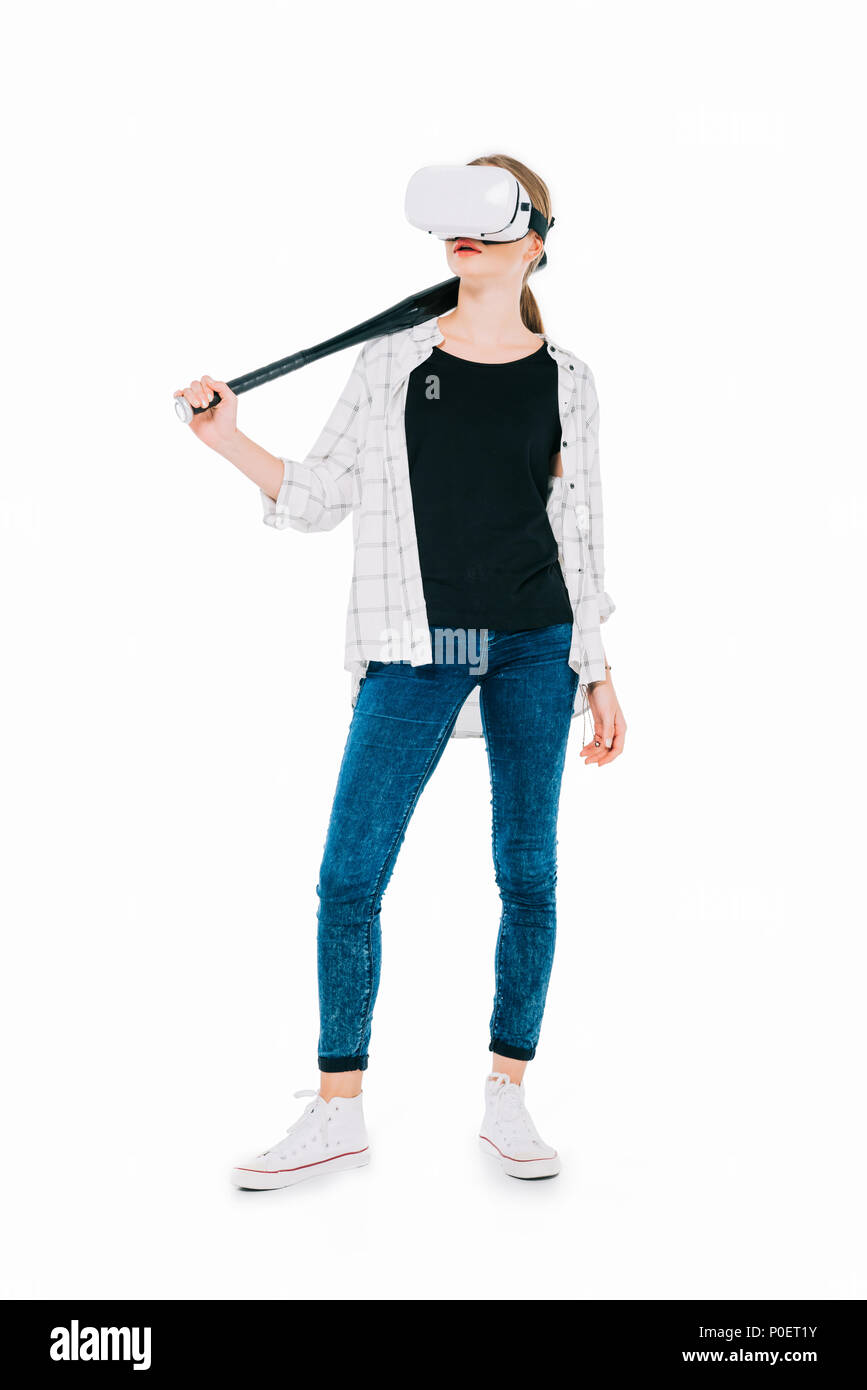 confident young woman in virtual reality headset holding baseball bat