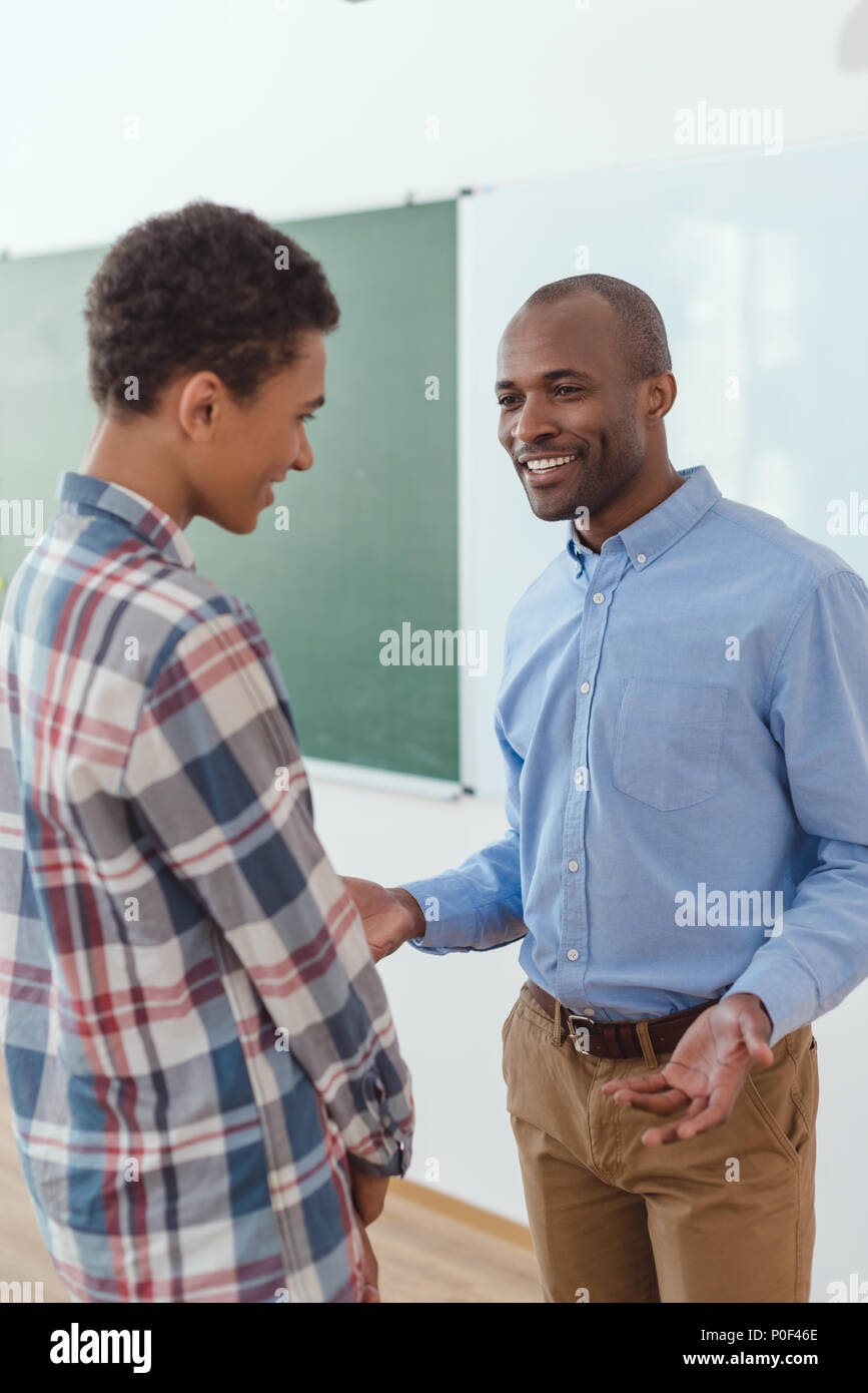Black teacher student talking hi-res stock photography and images - Alamy