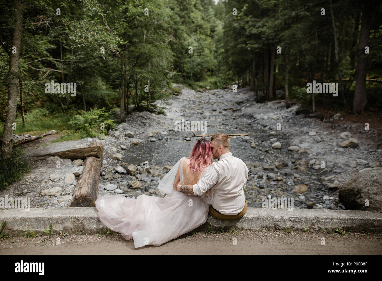 Bride and groom back view sitting hi-res stock photography and images ...