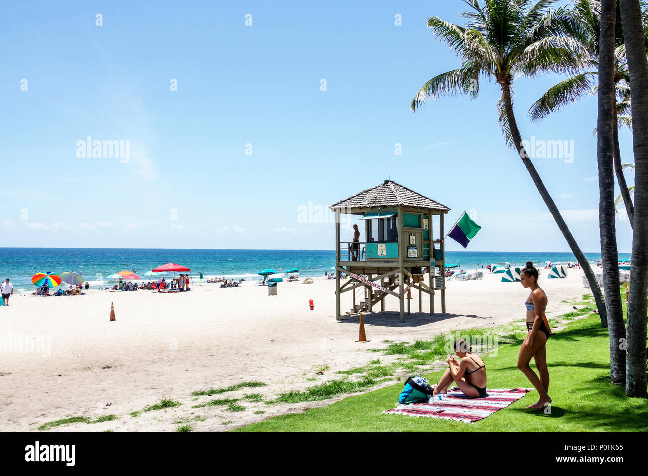 Florida Atlantic Ocean,Deerfield Beach,water,sand,lifeguard tower,palm trees,woman female women,sunbather,FL170725041 Stock Photo