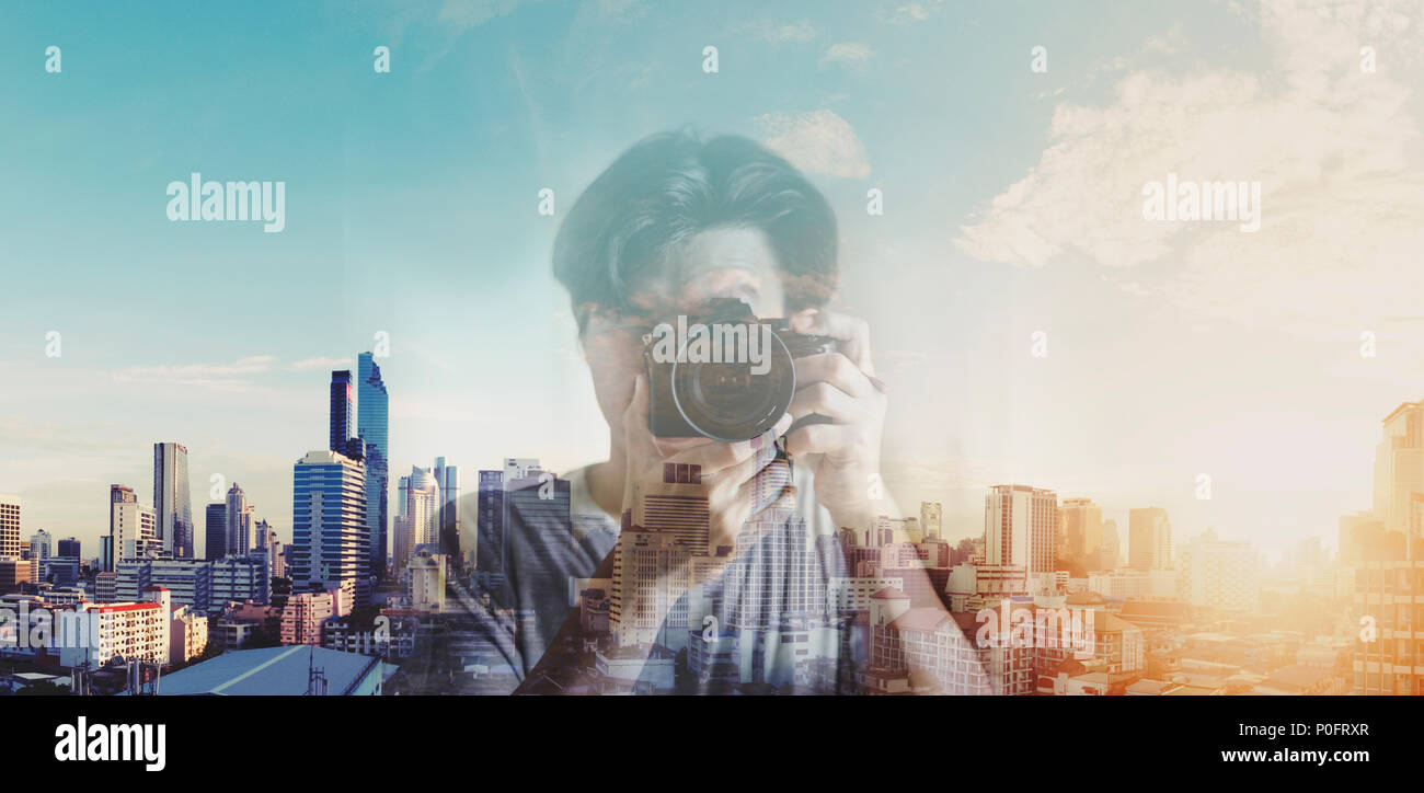 Double exposure, a man taking photography and city sunrise background Stock Photo