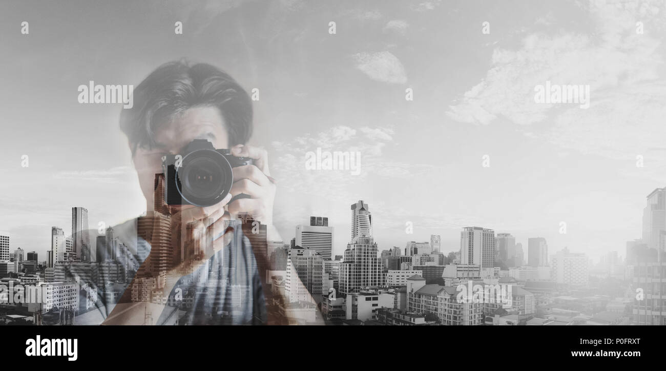 Double exposure, a man taking photography and black and white city background Stock Photo