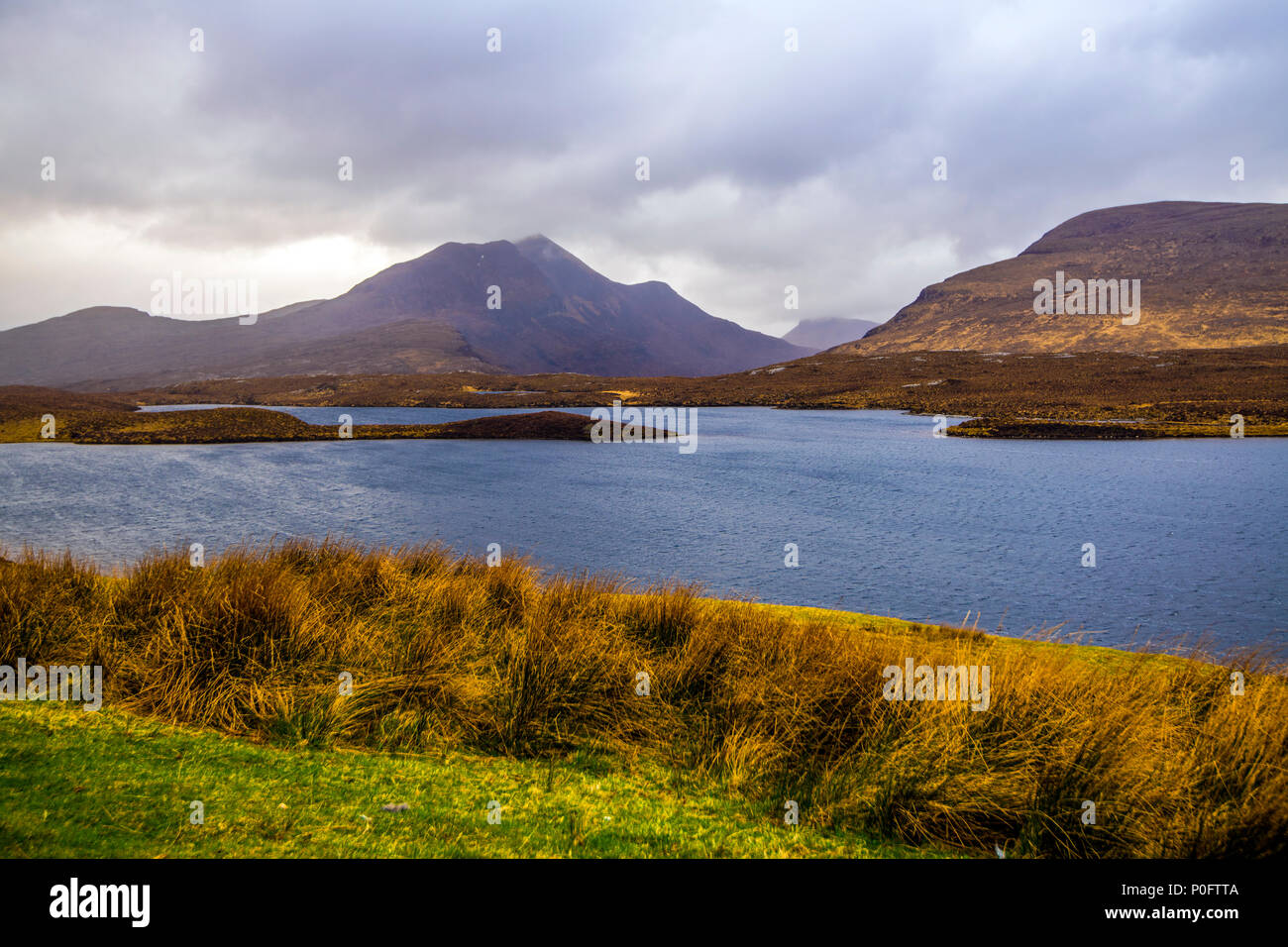 View across Lochan an Ais at the foot of Knockan Cliff centre of geological discovery for plate tectonics Stock Photo