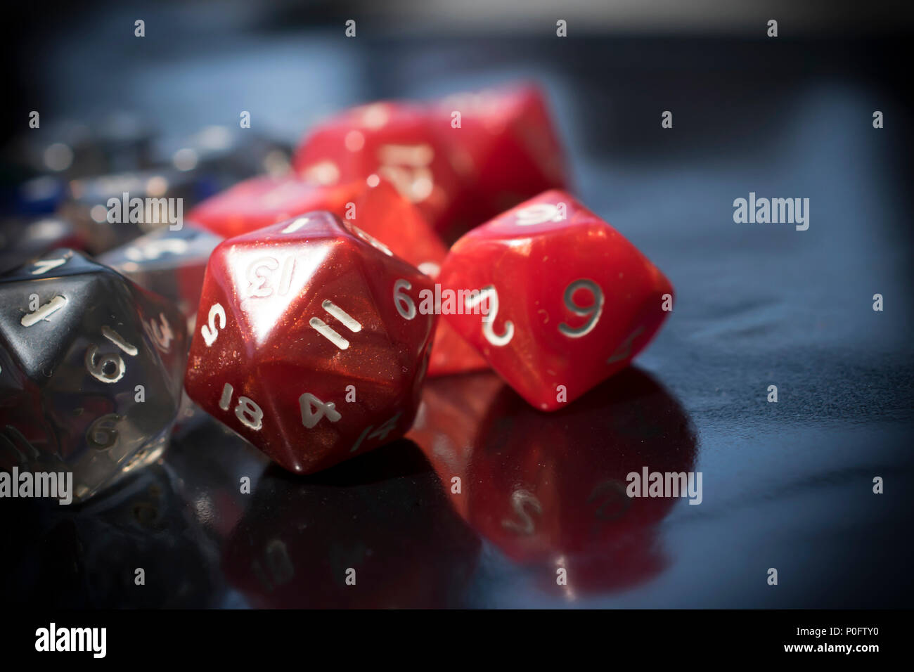 A set of colorful RPG dice on a black table Stock Photo