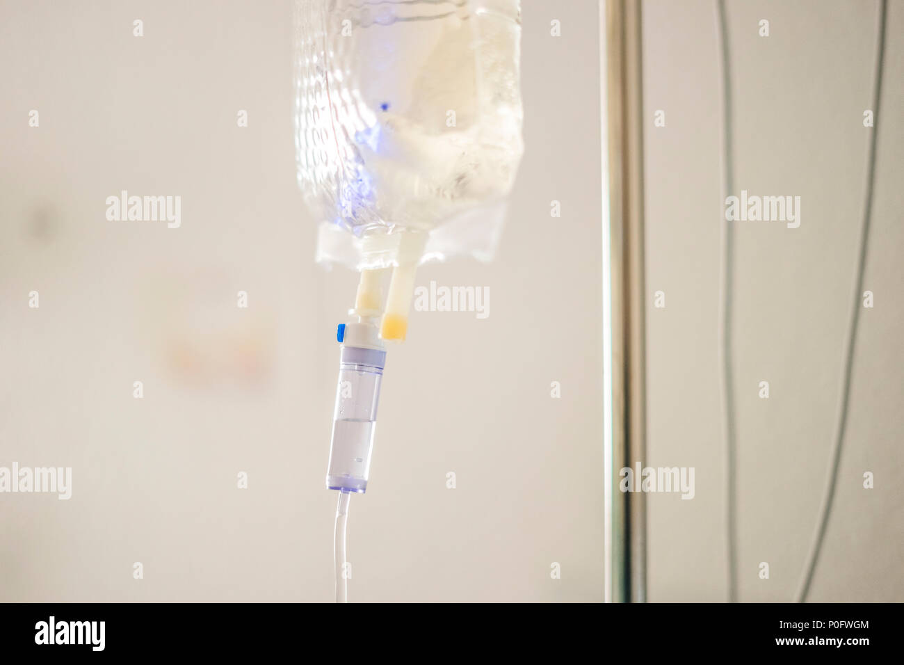 Close up of intravenous drip in the hospital on light background Stock Photo