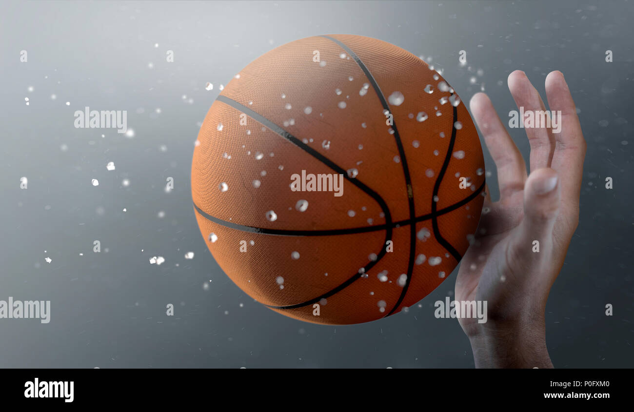 A closeup of a basket ball caught in slow motion flying through the air about to be caught by a dirty hand  - 3D render Stock Photo