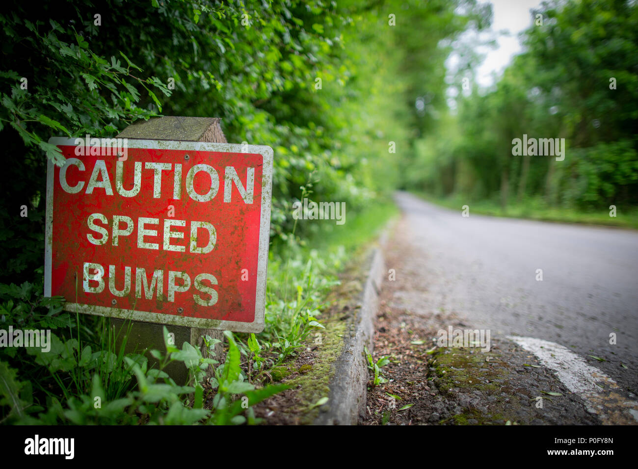 caution speed bumps sign along a narrow road in Lincolnshire England Stock Photo